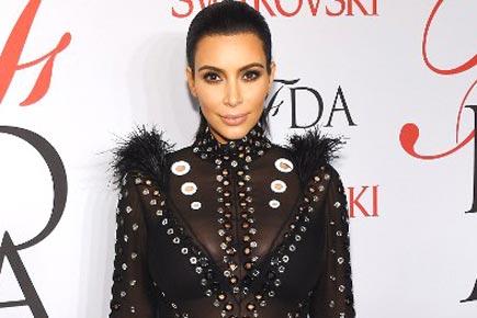 Kim Kardashian's dress catches on fire at CFDA Awards