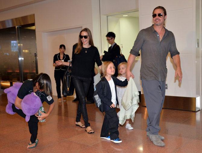 Angelina Jolie and Brad Pitt with their children. Pic/AFP