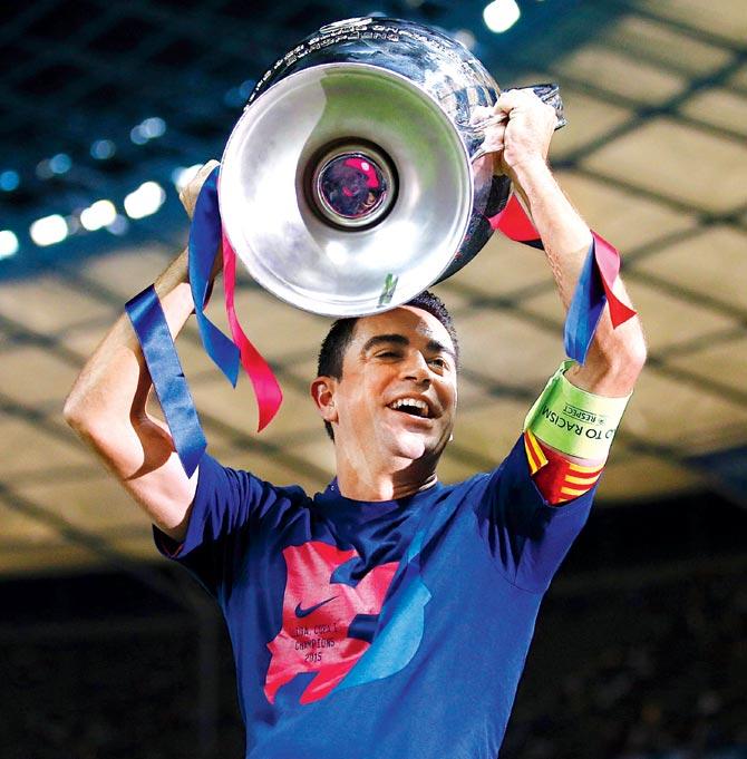 Xavi Hernandez lifts the Champions League trophy. Pic/Getty Images
