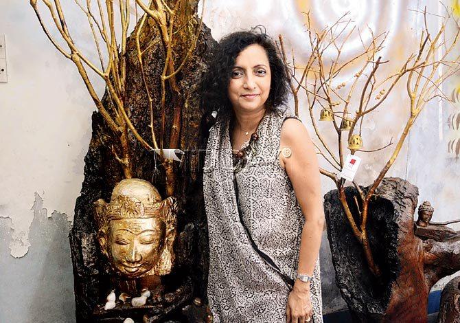 Beyond The Canvas owner Nandita Desai with one of the pieces in her Amida Buddha collection