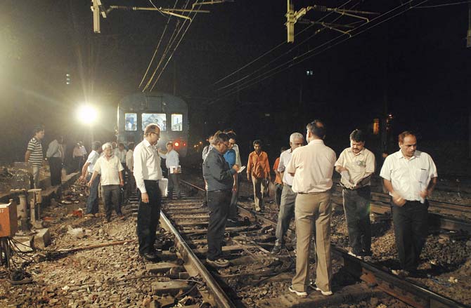 Central Railway officials carrying out an inspection of the power upgradation work between Thane and CST in the last week of May. File pic