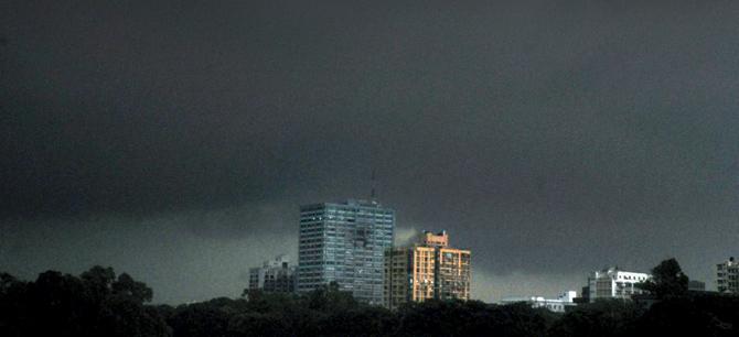 The skies are grey and the scene at Dalal Street is gloomy to match the mood. Pic/PTI
