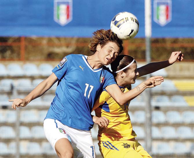 Italy: Cristiana Girelli (l) of Italy competes for the ball with Iya Andruschak of Ukraine during the FIFA Women’s World Cup Qualifier match between Italy and Ukraine