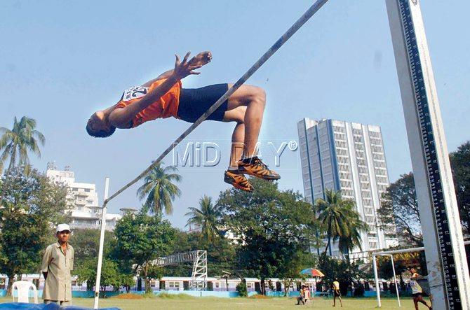 HIGH POINT: An athlete goes for the Fosbury Flop technique at a schools meet at University Stadium, Marine Lines. PIC/ATUL KAMBLE 