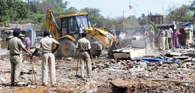 The police had to be called in when the angry slum dwellers began to pelt stones during the second demolition on Wednesday. Pics/Nimesh Dave