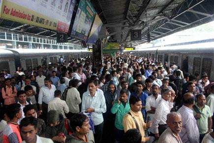 Rain-ravaged Mumbai limps back to normalcy, train services restored