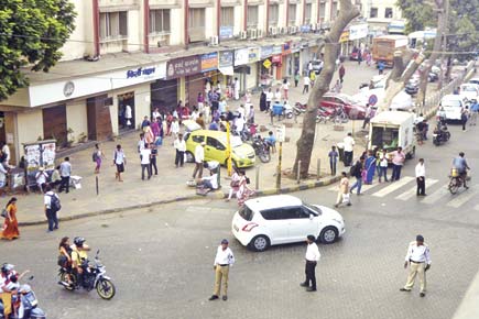 Mumbai: Cops want BMC to reduce footpath width at Parel TT