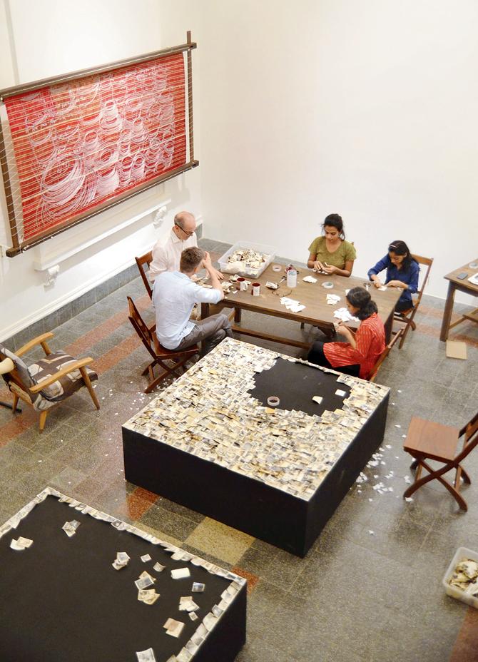 The interns (on the right) assisting the artist and curatorial team with the installation of the Missives exhibition