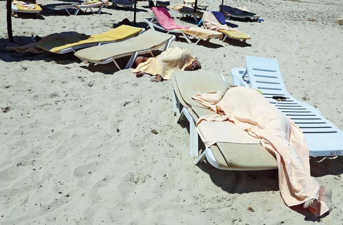 Covered bodies of victims of a mass-shooting are seen in the resort town of Sousse, a popular tourist destination 140 kilometres south of the Tunisian capital, following the attack on June 26. Pic/AFP