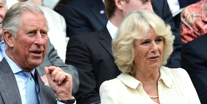 Prince Charles (L) and Camilla, Duchess of Cornwall (R) in the Royal Box on Center Court before the second round men