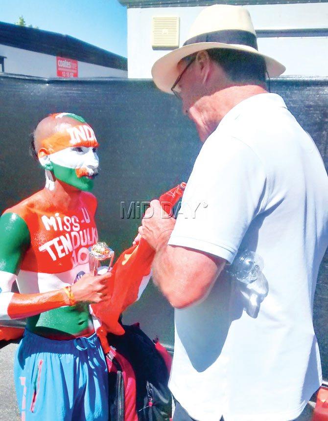 India fan Sudhir Gautam is questioned by WACA security manager Wayne Reynolds as his flagpole was over the prescribed limit during yesterday’s India vs West Indies match in Perth. pic/ashwin ferro