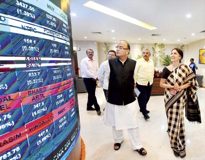 Finance Minister Arun Jaitley and Chitra Ramakrishna, MD & CEO, National Stock Exchange visiting the NSE office, in Mumbai over the weekend. Pic/PTI