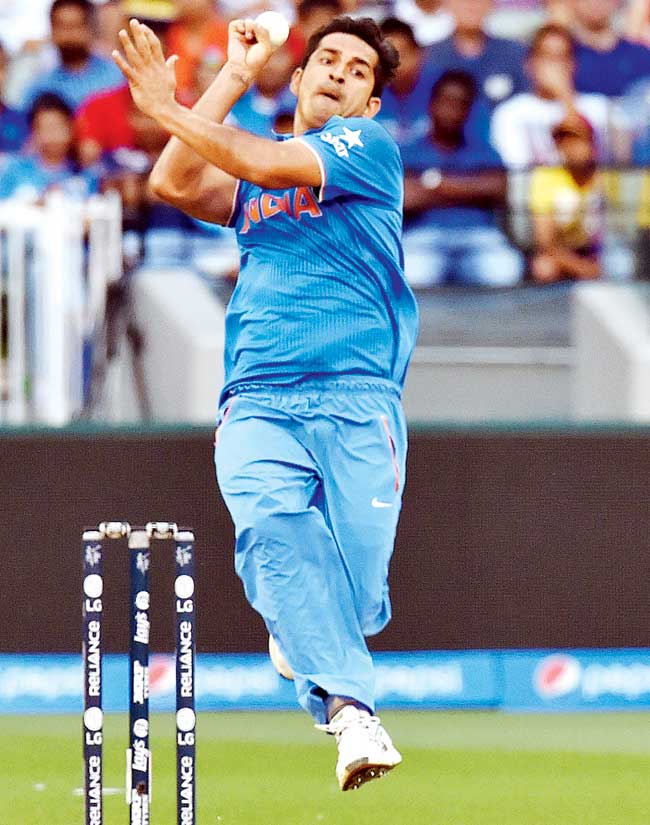 Pacer Mohit Sharma bowls during India