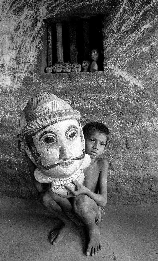 A tribal boy with a ceremonial mask, South Gujarat, 1987.
