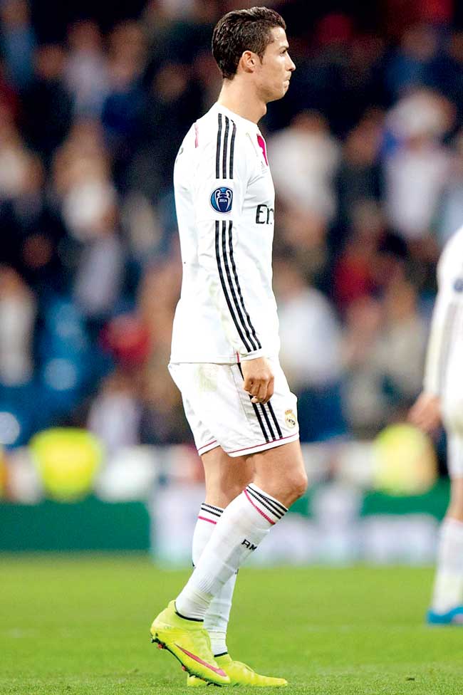 Cristiano Ronaldo walks off the pitch after the defeat to Schalke on Tuesday