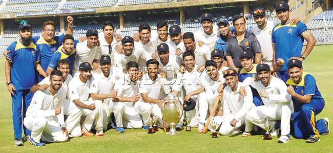 Karnataka celebrate retaining the Ranji Trophy at the Wankhede Stadium yesterday. Pics/Suresh KK