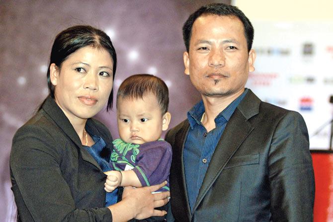 MC Mary Kom and her husband Onler with their son Prince at a Mumbai mall in 2013