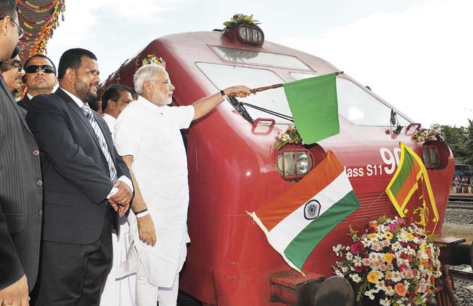 Prime Minister Narendra Modi flags off a train in Talaimannar town, the closest point to India in Sri Lanka. He sent a message to that country that India was dealing with it as a whole. Pic/AFP