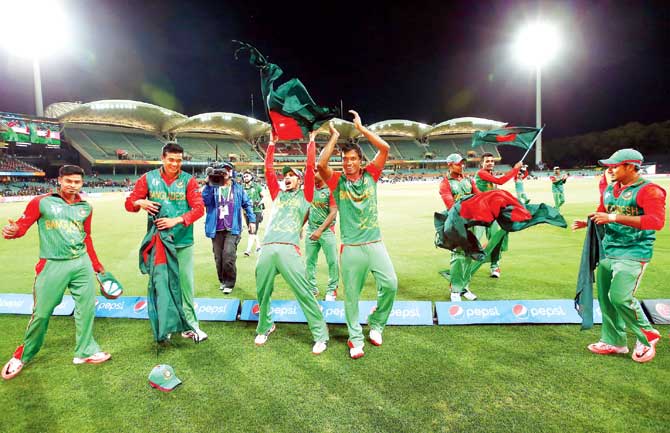 Bangladesh players celebrate their victory over England in Adelaide