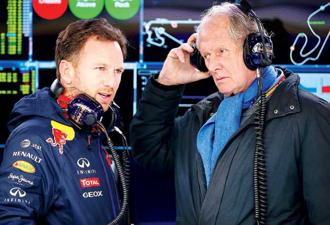 Red Bull team principal Christian Horner (left) speaks with team consultant Dr Helmut Marko. Pics/Getty Images