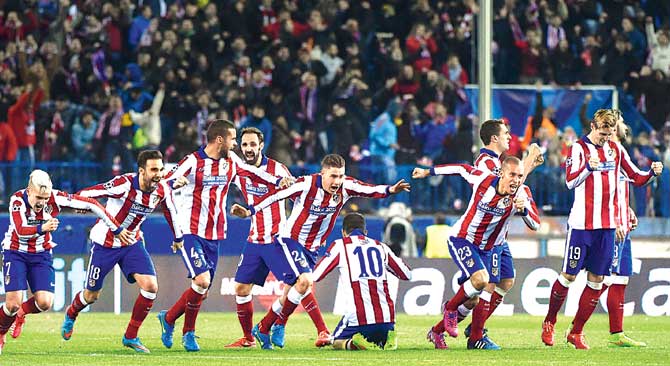 Atletico Madrid players celebrate their win over Bayer Leverkusen in penalty shoot-out in Madrid on Tuesday
