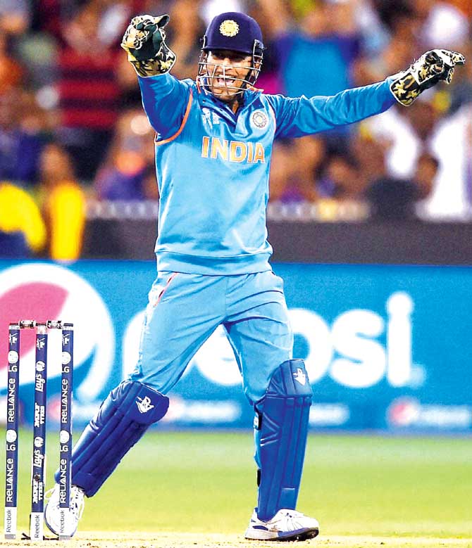 India captain MS Dhoni celebrates the dismissal of Bangladesh