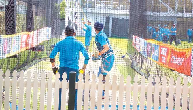 India skipper Mahendra Singh Dhoni serves down tennis balls to Suresh Raina during a net session at the Sydney Cricket Ground yesterday. Pic/Ashwin Ferro