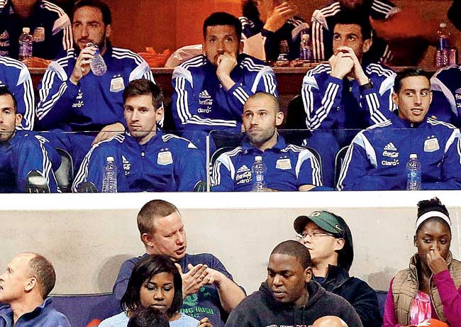 Lionel Messi watches an NBA match between Washington Wizards and Indiana Pacers with his teammates at Verizon Center, Washington. Pic/Getty Images/AFP