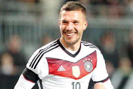 Podolski saves Germany with late strike