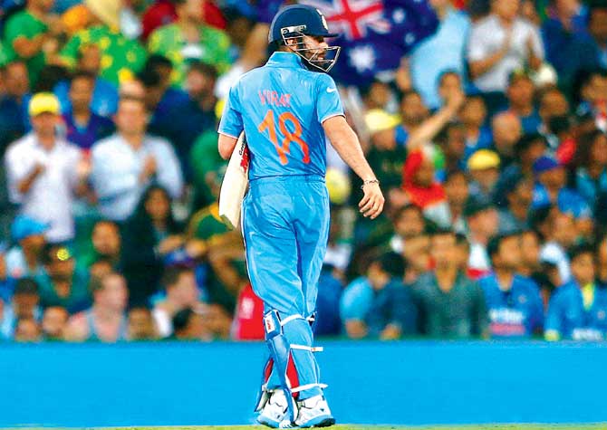 A dejected Virat Kohli departs for one during the World Cup semi-final against Australia at the SCG yesterday. Pic/Getty Images