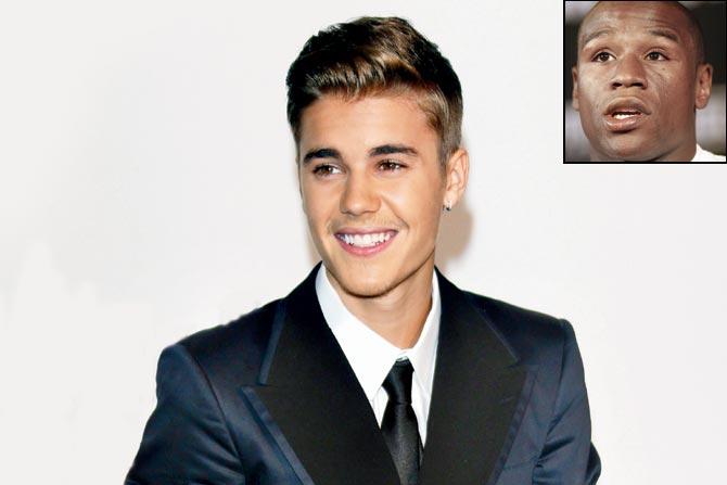 Justin Bieber. (inset) Boxer Floyd Mayweather 
