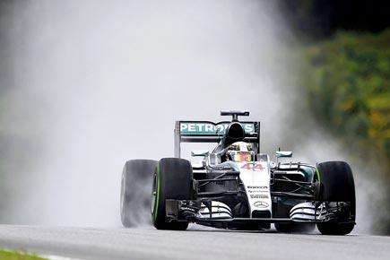 Lewis Hamilton claims pole in Malaysia despite torrential downpour