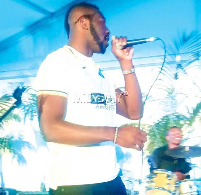 Andre Russell sings a song as 500-odd fans egg him on