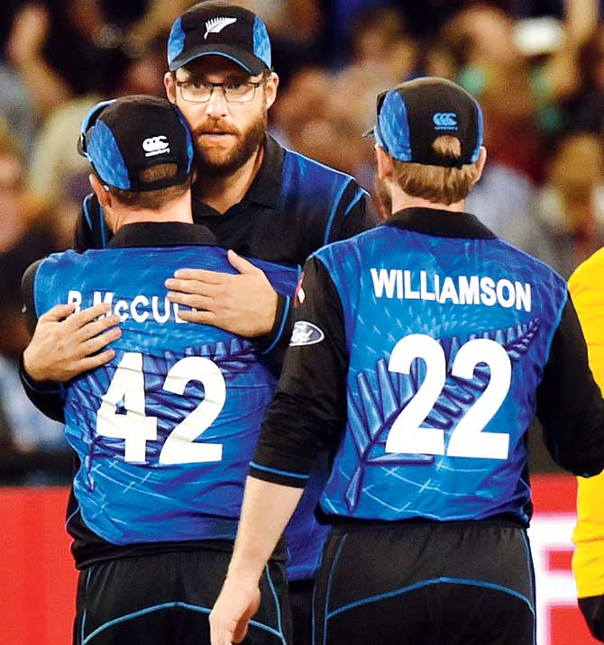 Daniel Vettori hugs skipper Brendon McCullum after NZ