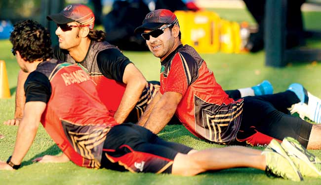 Afghanistan players warm-up during a training session in Perth yesterday. Pic/AFP