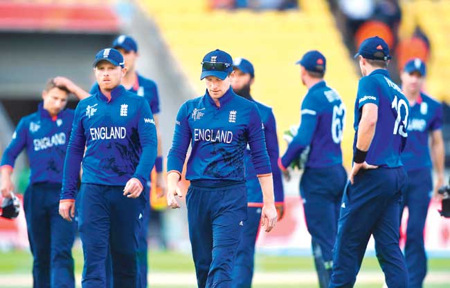 England captain Eoin Morgan leads his team off after their nine-wicket loss to Sri Lanka at Wellington Regional Stadium. Pic/Getty Images
