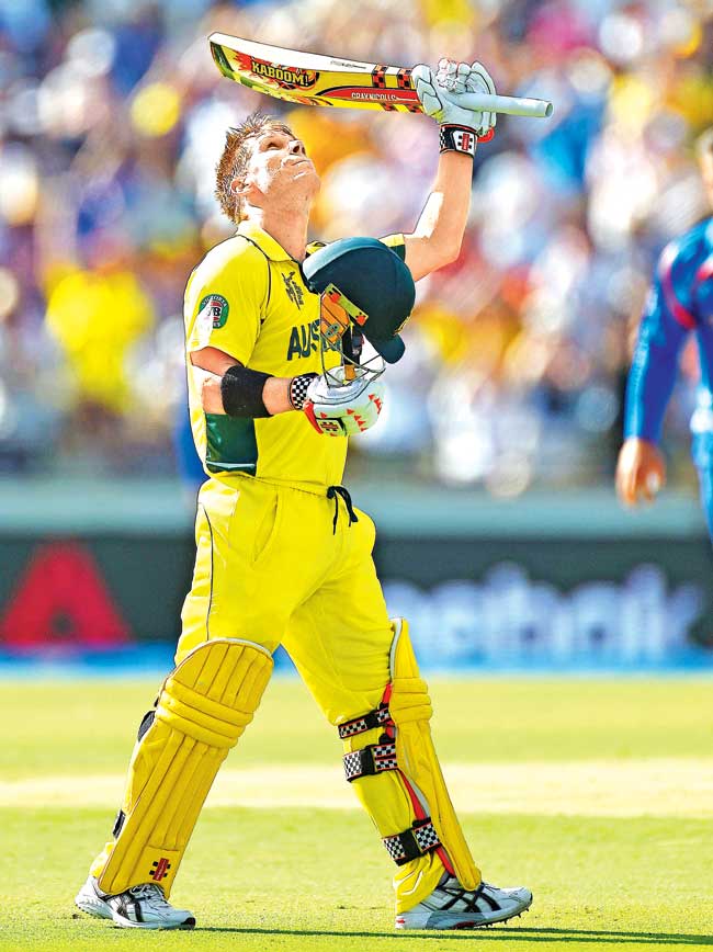 David Warner celebrates his century against Afghanistan yesterday. Pic/Getty Images