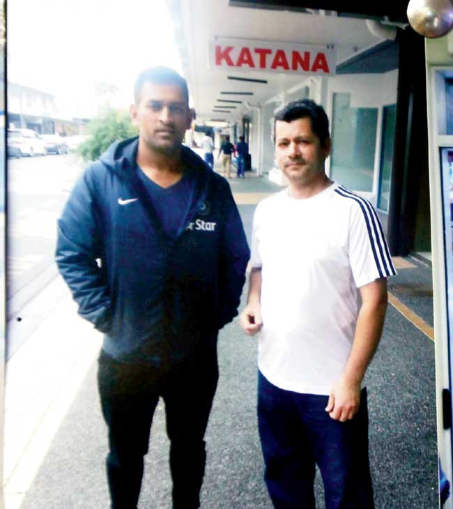 Skipper MS Dhoni with a fan at the kebab joint in January 2014