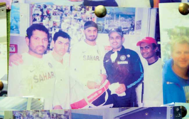 A picture of Sachin Tendulkar, Virender Sehwag and Harbhajan Singh with fans at the kebab joint put up on the wall of the restaurant