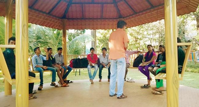 A volunteer conducts classes in the garden opposite Pragat Vidya Mandir School in Andheri