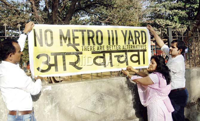 Activists put up posters near the proposed site at Aarey colony last week. Pic/Suresh KK