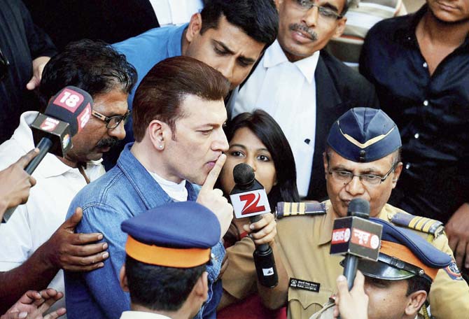 Aditya Pancholi gestures to mediapersons after he was released on bail yesterday. This is not the first time the actor has run into trouble, whether for thrashing his neighbours or for arguments with the press in the past. Pic/PTI