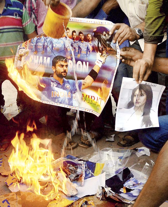 After the Indian cricket team’s defeat against Australia in the World Cup semi-final yesterday, misogyny was on display on social media, when actor Anushka Sharma was trolled because of Virat Kohli’s performance on the field. Angry cricket fans even burned posters of Anushka and Virat in Ahmedabad. Pic/PTI