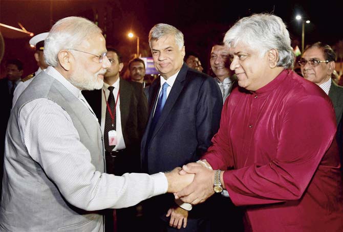 Prime Minister Modi with former cricketer Arjuna Ranatunga. Events and actions of countries in the IOR littoral have security implications for India. Pic/PTI