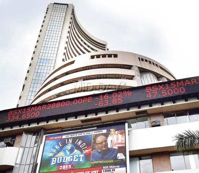 A display board shows the share prices at the Bombay Stock Exchange (BSE) building in Mumbai on Saturday during the Union Budget 2015-16 presentation in the Lok Sabha. Pic/ PTI