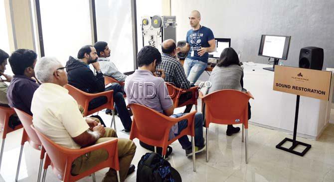 Gilles Barberis (standing) from L’Immagine Ritrovata gives a practical lesson on sound restoration