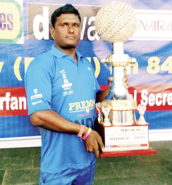 A triumphant Kailash Ghanekar with the Asia Cup trophy