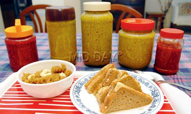 Kankecha Sheera and Brown Bread Mustard Chilli Chutney and Cheese Sandwiches with a variety of pickles made from Pathak’s recipe book