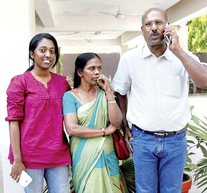 Rinu Shrinivasan with her parents in Ahmedabad yesterday. Rinu and her friend, Shaheen Dhada, were arrested in 2012 for the latter’s Facebook post questioning Mumbai’s shutdown after Bal Thackeray’s death. Rinu had ‘liked’ the post. Pic/PTI