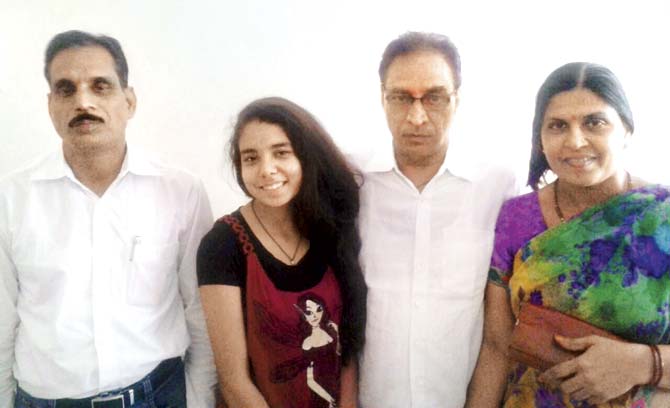 The Sharma family was pleasantly surprised when they got a call from coach attendant Tulsidas Mishra (left) who informed them that he had recovered their purse from the train